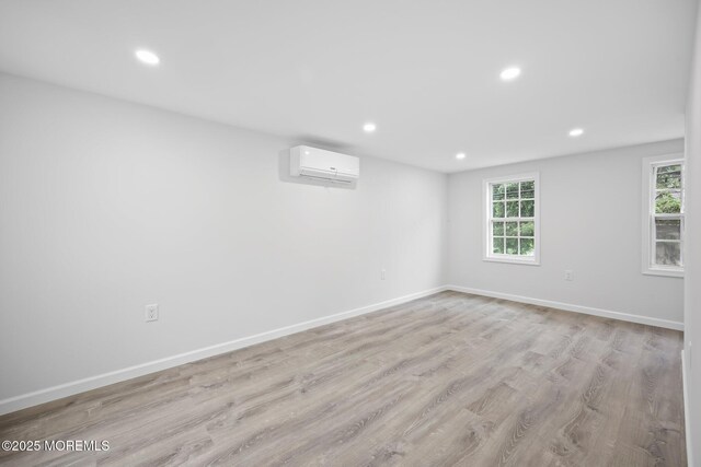 47 Imlaystown Rd, Cream Ridge, NJ 08514 - empty room with a wall unit AC, recessed lighting, light wood-style floors, and baseboards