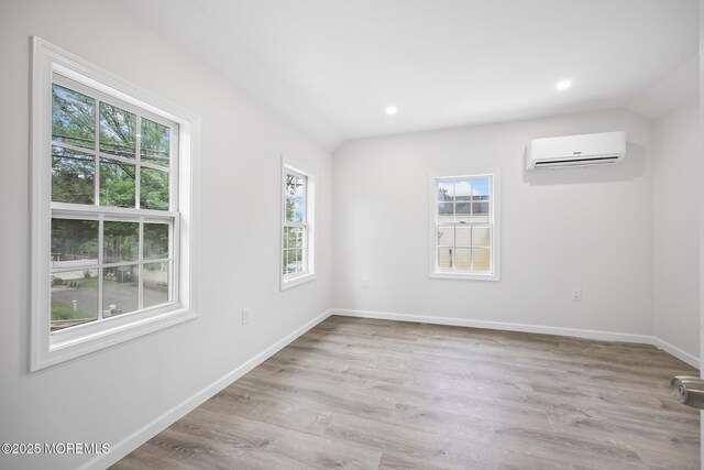 47 Imlaystown Rd, Cream Ridge, NJ 08514 - empty room with a wall unit AC, healthy amount of natural light, wood finished floors, and recessed lighting