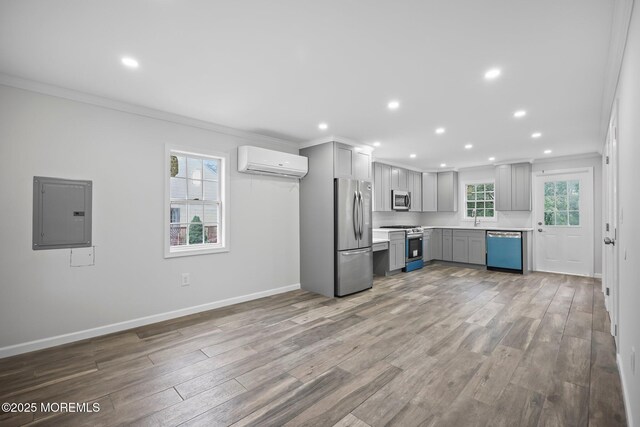 47 Imlaystown Rd, Cream Ridge, NJ 08514 - kitchen featuring stainless steel appliances, electric panel, a wall mounted air conditioner, gray cabinetry, and ornamental molding