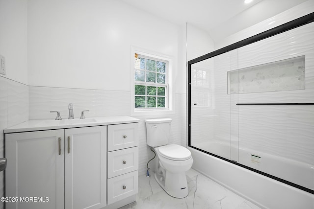 47 Imlaystown Rd, Cream Ridge, NJ 08514 - bathroom with marble look tile flooring, toilet, vanity, and combined bath / shower with glass door