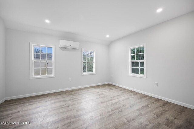 47 Imlaystown Rd, Cream Ridge, NJ 08514 - unfurnished room featuring a wall mounted air conditioner, recessed lighting, wood finished floors, and baseboards