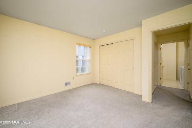585 Waterford Dr, Manchester, NJ 08759 - unfurnished bedroom with carpet floors, baseboards, and a closet