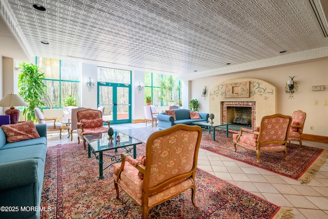 585 Waterford Dr, Manchester, NJ 08759 - living area featuring healthy amount of natural light, light tile patterned floors, an ornate ceiling, a fireplace, and baseboards
