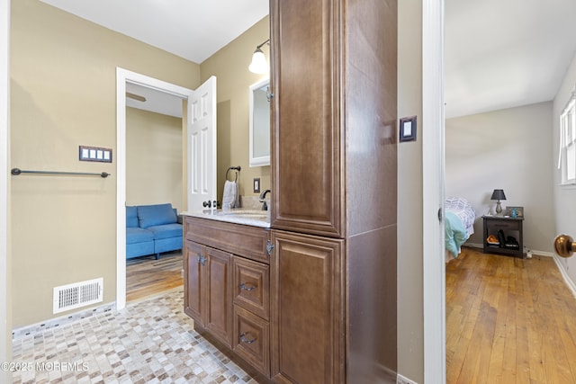 15 Creighton Cir, Old Bridge, NJ 08857 - ensuite bathroom with wood finished floors, vanity, and baseboards