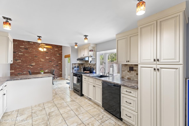 15 Creighton Cir, Old Bridge, NJ 08857 - kitchen featuring black appliances, cream cabinetry, under cabinet range hood, a sink, and tasteful backsplash