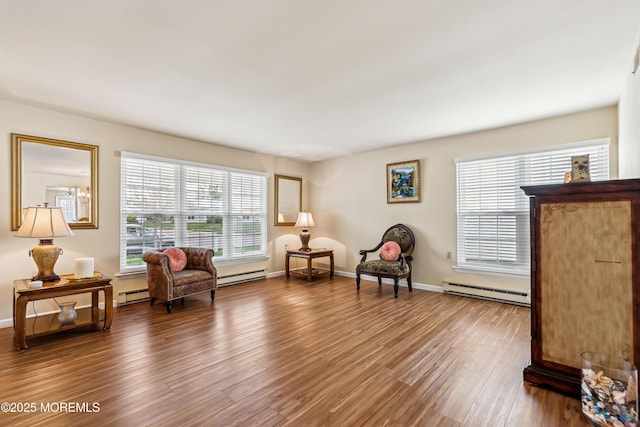 27 Gladstone Ave, Manchester, NJ 08759 - living area with a baseboard heating unit, wood finished floors, a baseboard radiator, and baseboards