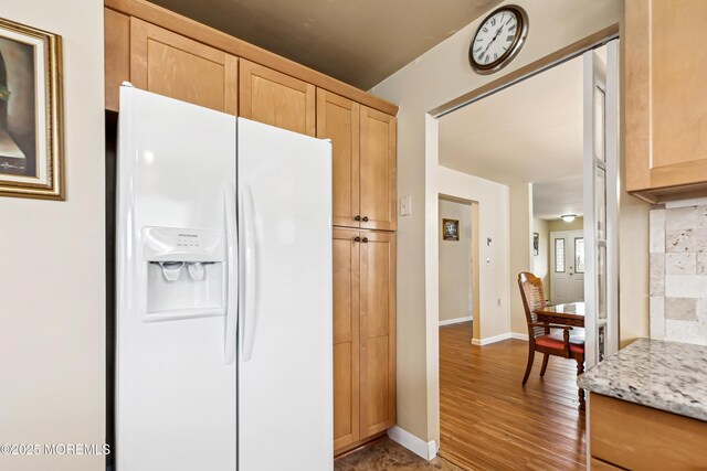 27 Gladstone Ave, Manchester, NJ 08759 - kitchen featuring white fridge with ice dispenser, light brown cabinetry, wood finished floors, and baseboards