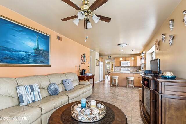 27 Gladstone Ave, Manchester, NJ 08759 - living room with a ceiling fan