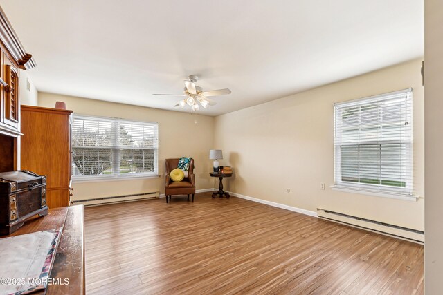 27 Gladstone Ave, Manchester, NJ 08759 - unfurnished room with a baseboard heating unit, light wood finished floors, ceiling fan, and baseboards