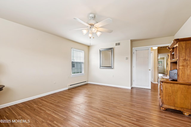 27 Gladstone Ave, Manchester, NJ 08759 - unfurnished bedroom with a baseboard heating unit, light wood-type flooring, baseboards, and a ceiling fan