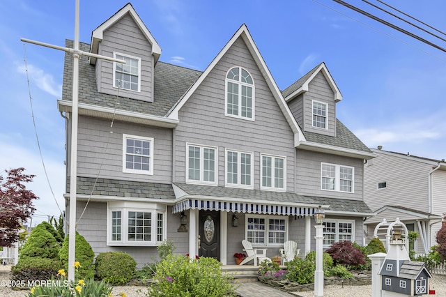 view of front of home featuring roof with shingles