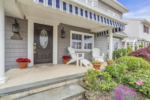 property entrance featuring covered porch