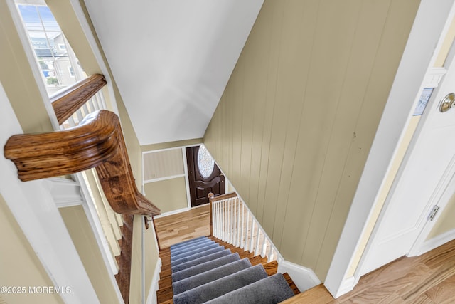 stairway with wood finished floors