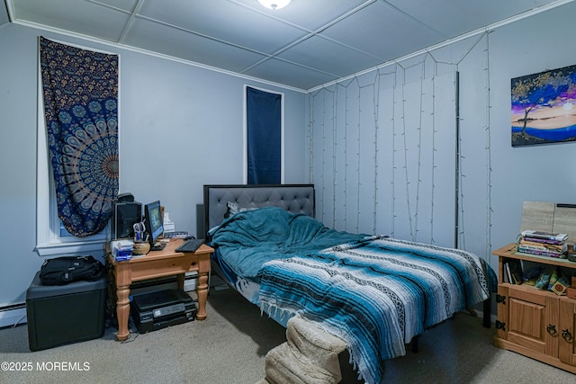carpeted bedroom featuring a baseboard radiator