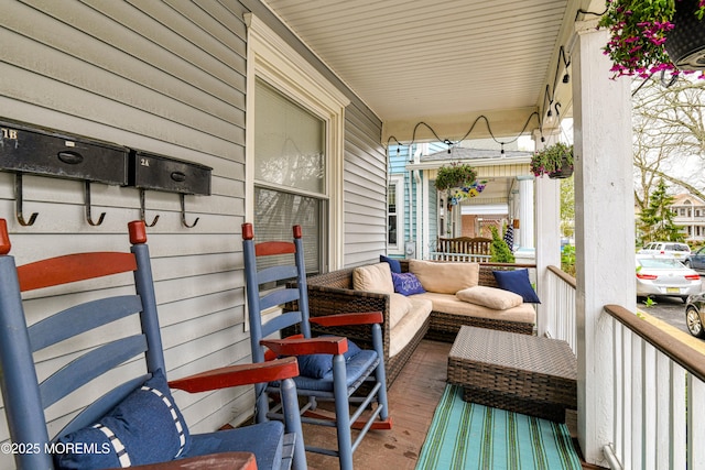 balcony featuring a porch