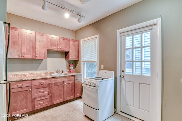 laundry room with track lighting
