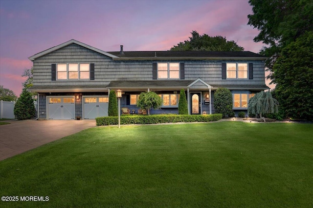 55 Yorktowne Dr, Manalapan, NJ 07726 - view of front of home with concrete driveway, a yard, and an attached garage