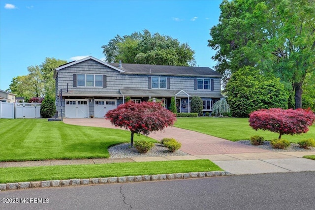 55 Yorktowne Dr, Manalapan, NJ 07726 - view of front of property with an attached garage and decorative driveway