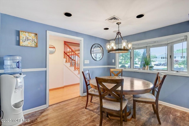55 Yorktowne Dr, Manalapan, NJ 07726 - dining room featuring stairway, wood finished floors, a chandelier, and baseboards