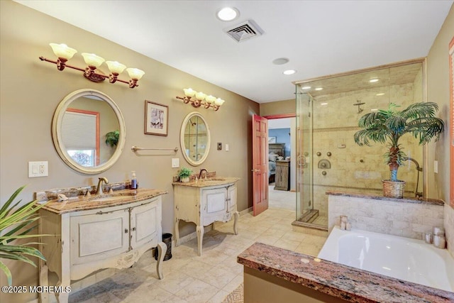 55 Yorktowne Dr, Manalapan, NJ 07726 - full bath featuring a stall shower, two vanities, a bath, recessed lighting, and tile patterned floors