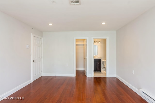 7 Danbury Ct, Red Bank, NJ 07701 - unfurnished bedroom featuring baseboard heating, wood finished floors, recessed lighting, and a spacious closet
