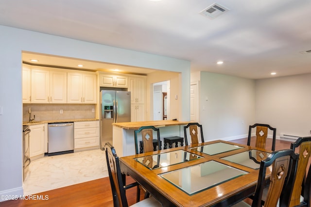 7 Danbury Ct, Red Bank, NJ 07701 - dining room with recessed lighting and a baseboard radiator