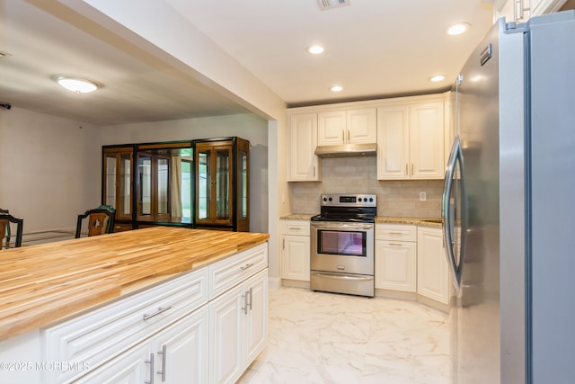 7 Danbury Ct, Red Bank, NJ 07701 - kitchen with stainless steel appliances, wood counters, under cabinet range hood, light marble finish floors, and backsplash