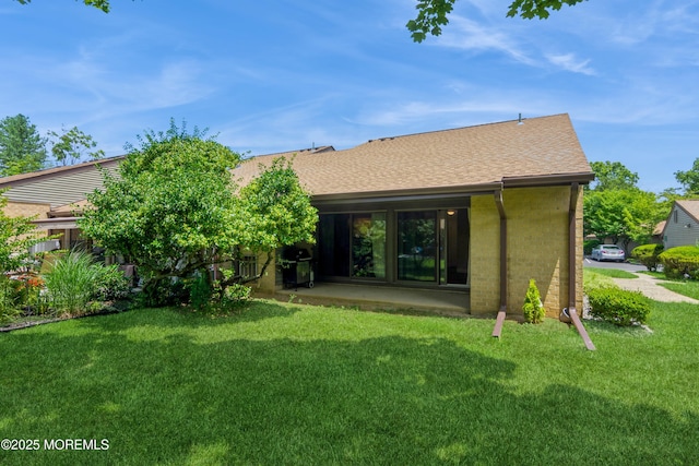 7 Danbury Ct, Red Bank, NJ 07701 - rear view of house with a lawn and roof with shingles