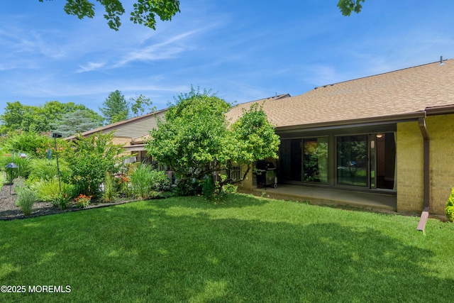 7 Danbury Ct, Red Bank, NJ 07701 - view of grassy yard with a patio area