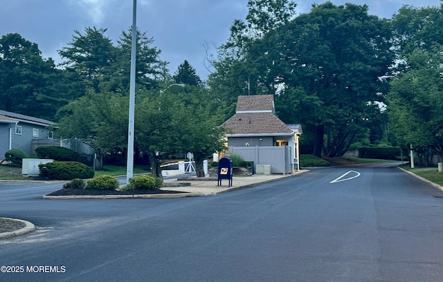 7 Danbury Ct, Red Bank, NJ 07701 - view of asphalt street featuring curbs and street lights