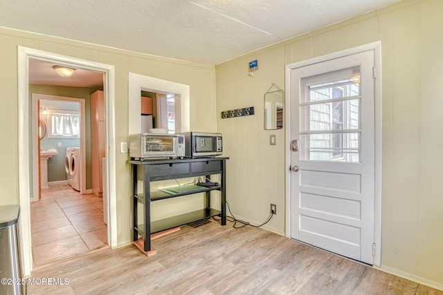 70 Clark Ave, Ocean Grove, NJ 07756 - entryway with washer / dryer, wood finished floors, and a textured ceiling
