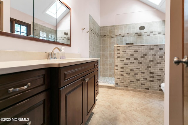 112 Deer Path Ln, Freehold, NJ 07728 - bathroom featuring a skylight, vanity, a walk in shower, toilet, and tile patterned flooring