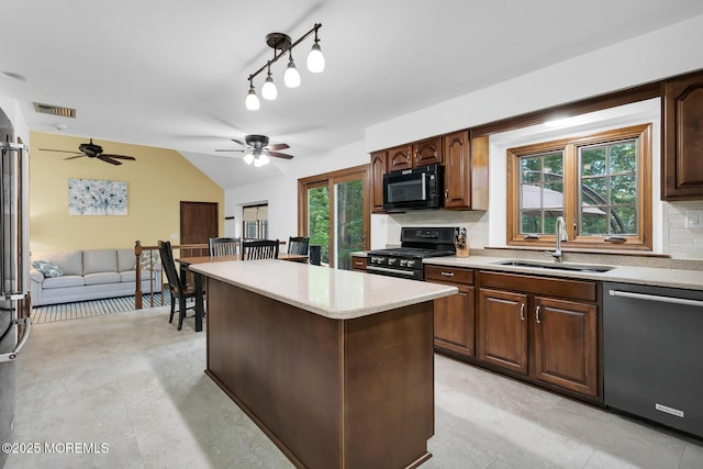 112 Deer Path Ln, Freehold, NJ 07728 - kitchen featuring black appliances, a sink, decorative backsplash, a ceiling fan, and lofted ceiling