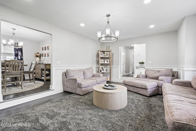 639 Longview Dr, Toms River, NJ 08753 - living room with a chandelier, wood finished floors, recessed lighting, wainscoting, and a decorative wall