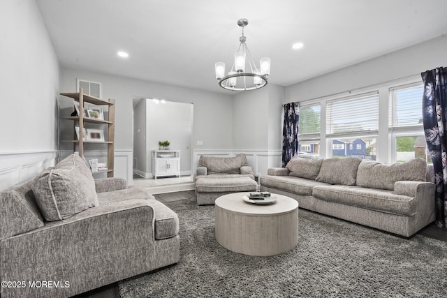 639 Longview Dr, Toms River, NJ 08753 - living area with a chandelier, a wainscoted wall, recessed lighting, wood finished floors, and a decorative wall