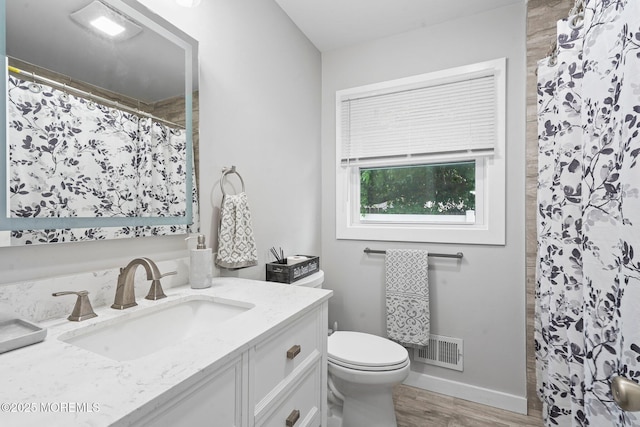 639 Longview Dr, Toms River, NJ 08753 - full bath with vanity, toilet, wood finished floors, a shower with shower curtain, and baseboards