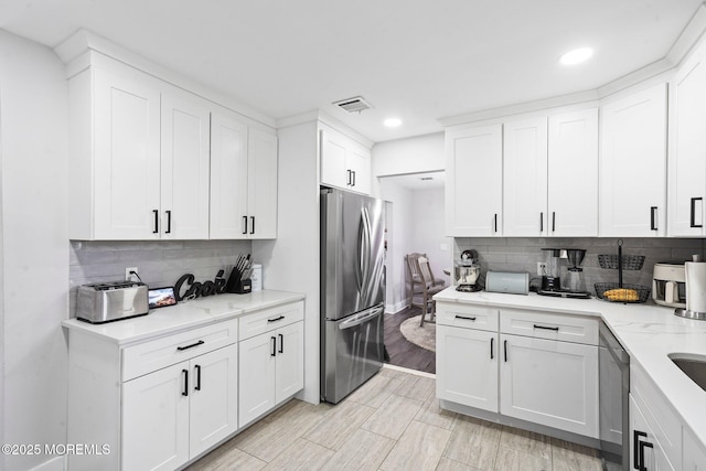 639 Longview Dr, Toms River, NJ 08753 - kitchen featuring freestanding refrigerator, recessed lighting, dishwashing machine, decorative backsplash, and white cabinets
