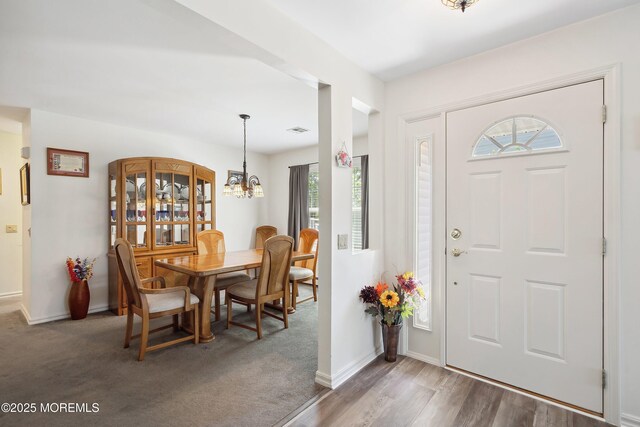 14 Winterton Dr, Toms River, NJ 08757 - entryway featuring healthy amount of natural light, a chandelier, baseboards, and wood finished floors