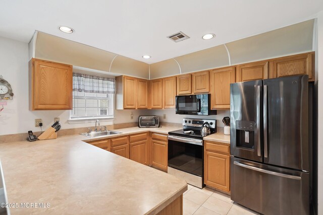 14 Winterton Dr, Toms River, NJ 08757 - kitchen featuring stainless steel appliances, a sink, light countertops, light tile patterned flooring, and recessed lighting