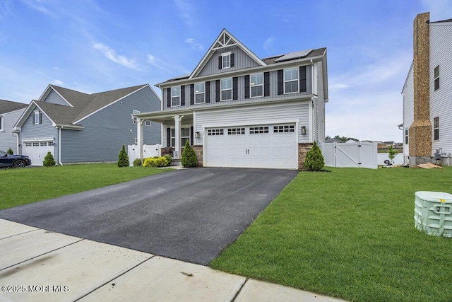 83 Weston Dr, Woolwich, NJ 08085 - view of front of house with a gate, driveway, covered porch, board and batten siding, and a garage