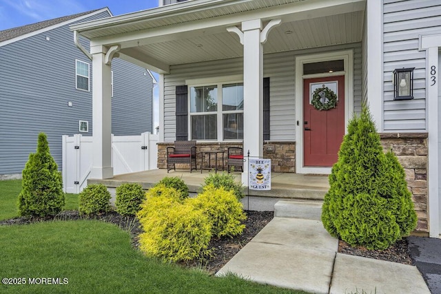 83 Weston Dr, Woolwich, NJ 08085 - view of exterior entry featuring a porch, stone siding, and a gate