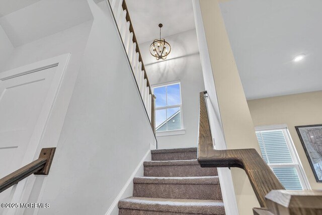 83 Weston Dr, Woolwich, NJ 08085 - staircase featuring a chandelier