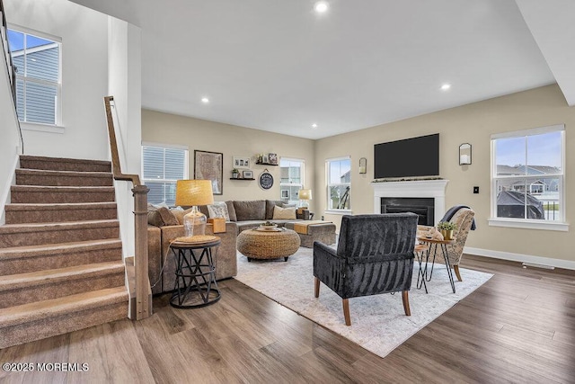 83 Weston Dr, Woolwich, NJ 08085 - living room featuring wood finished floors, stairway, a fireplace, recessed lighting, and baseboards