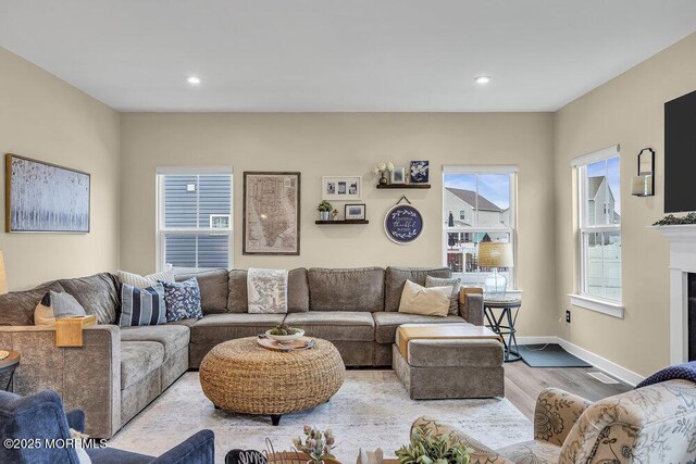 83 Weston Dr, Woolwich, NJ 08085 - living area featuring wood finished floors, baseboards, recessed lighting, and a fireplace