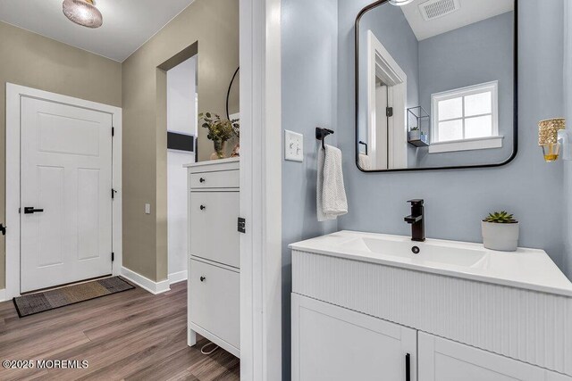 83 Weston Dr, Woolwich, NJ 08085 - bathroom featuring wood finished floors, vanity, and baseboards