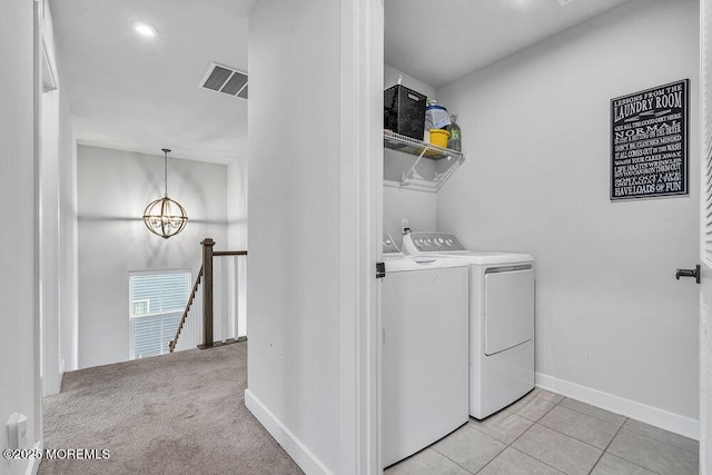 83 Weston Dr, Woolwich, NJ 08085 - washroom with washer and dryer, a chandelier, baseboards, and light tile patterned floors