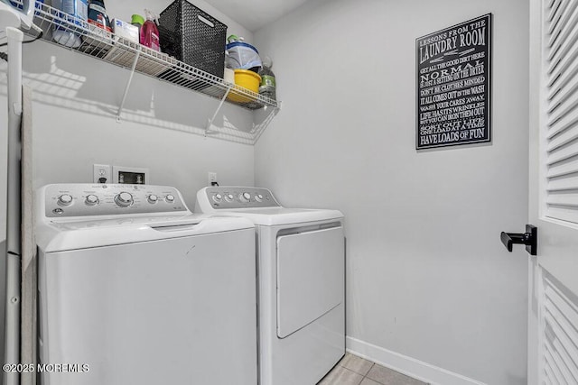 83 Weston Dr, Woolwich, NJ 08085 - laundry area featuring washer and dryer, light tile patterned floors, and baseboards