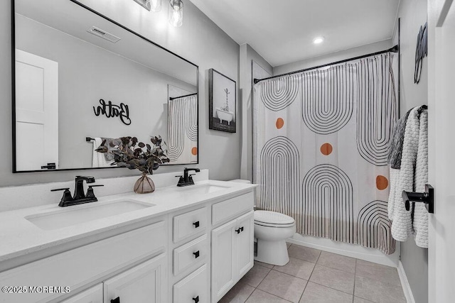 83 Weston Dr, Woolwich, NJ 08085 - bathroom featuring tile patterned floors, double vanity, toilet, and shower / bath combo