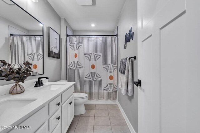 83 Weston Dr, Woolwich, NJ 08085 - bathroom featuring tile patterned flooring, toilet, double vanity, baseboards, and recessed lighting