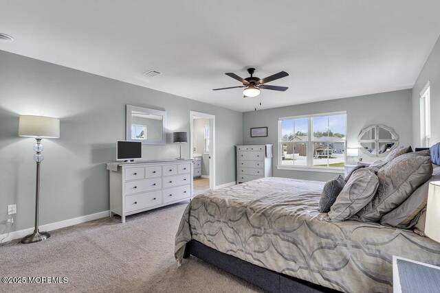 83 Weston Dr, Woolwich, NJ 08085 - bedroom featuring light carpet, baseboards, ceiling fan, and ensuite bathroom